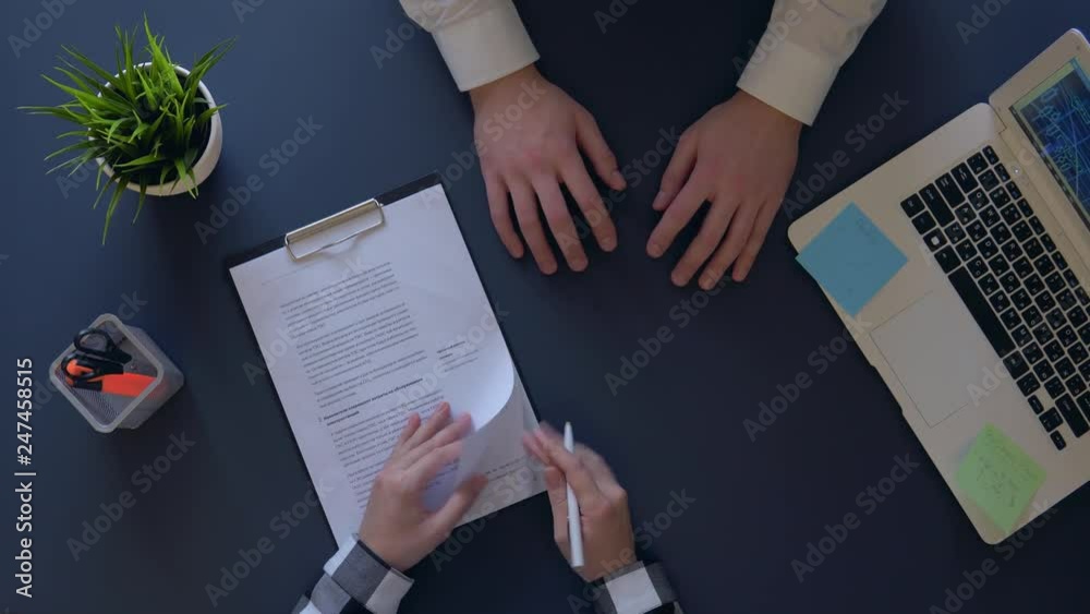 business man waiting for signing a contract with a partner sitting at the table. overhead shot business man waiting for signing a contract with a partner sitting at the table. overhead shot