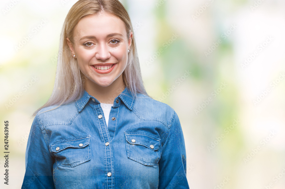 Young blonde woman over isolated background with a happy and cool smile on face. Lucky person. Young blonde woman over isolated background with a happy and cool smile on face. Lucky person.