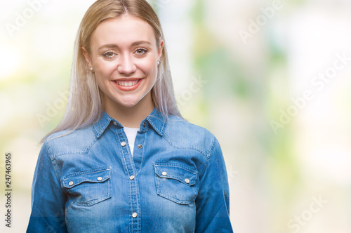 Young blonde woman over isolated background with a happy and cool smile on face. Lucky person.