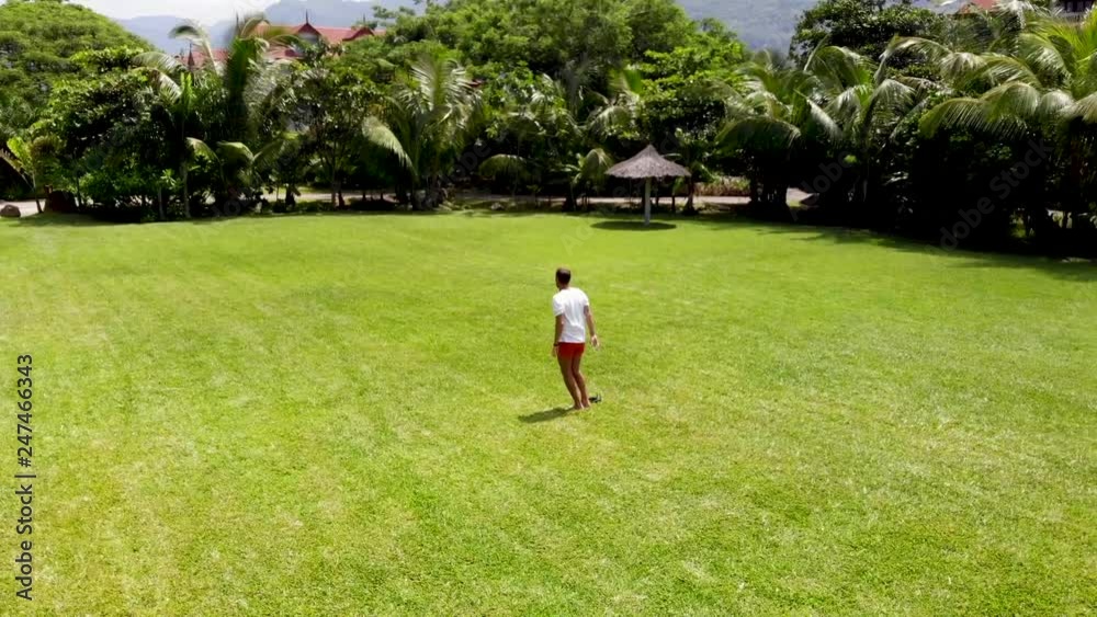A young man is testing a drone. Incredibly beautiful island la digue. Aerial footage from the drone in the Seychelles. A young man is testing a drone. Incredibly beautiful island la digue. Aerial footage from the drone in the Seychelles.