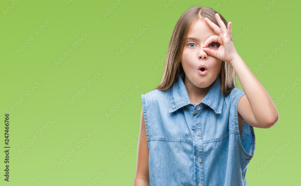 Young beautiful girl over isolated background doing ok gesture shocked with surprised face, eye looking through fingers. Unbelieving expression. Young beautiful girl over isolated background doing ok gesture shocked with surprised face, eye looking through fingers. Unbelieving expression.