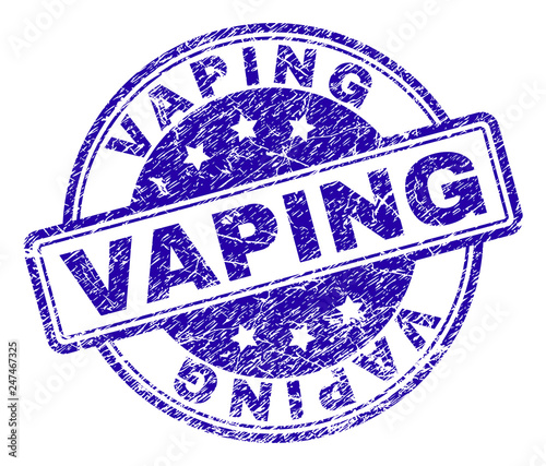 VAPING stamp seal imprint with distress texture. Designed with rounded rectangles and circles. Blue vector rubber print of VAPING caption with dust texture.