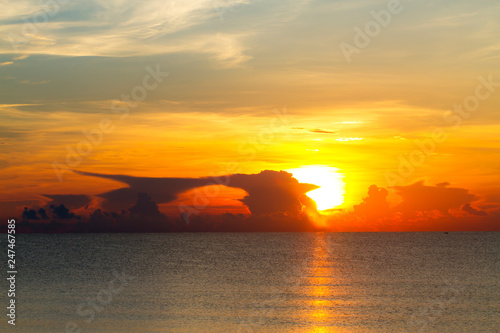 Sunrise with silhouette on water at beach Ban Krut