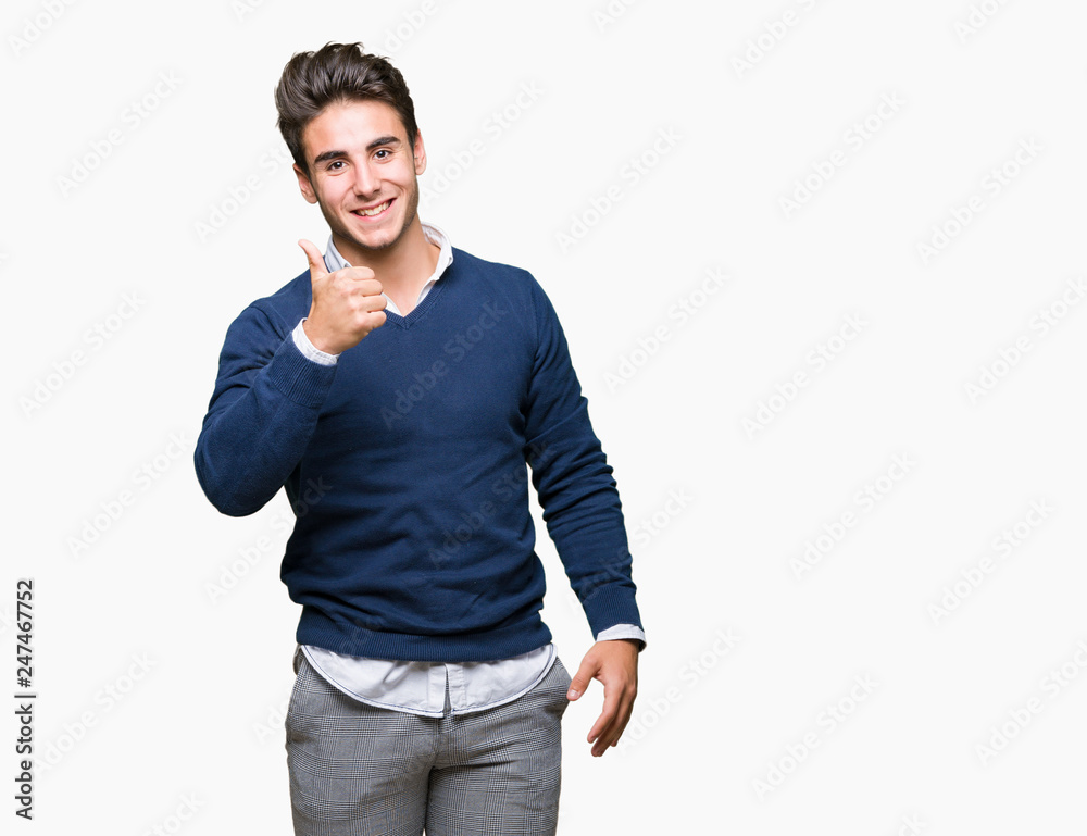 Young handsome business man over isolated background doing happy thumbs up gesture with hand. Approving expression looking at the camera with showing success. Young handsome business man over isolated background doing happy thumbs up gesture with hand. Approving expression looking at the camera with showing success.