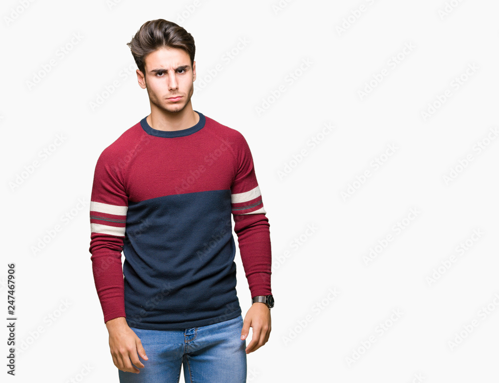 Young handsome man over isolated background skeptic and nervous, frowning upset because of problem. Negative person. Young handsome man over isolated background skeptic and nervous, frowning upset because of problem. Negative person.