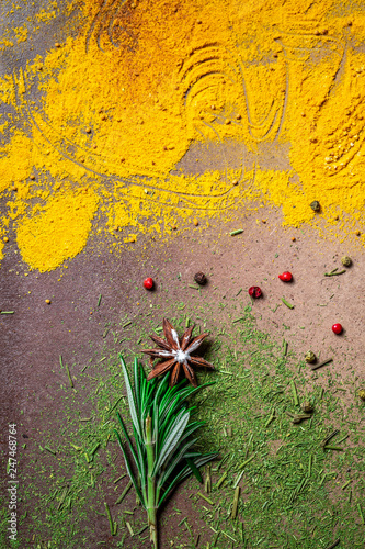 Group of colored spice. Background assortment of different hot chili, thyme, anise, pepper peas, in the form of a flowerall, mix spices. Top view. space for text photo