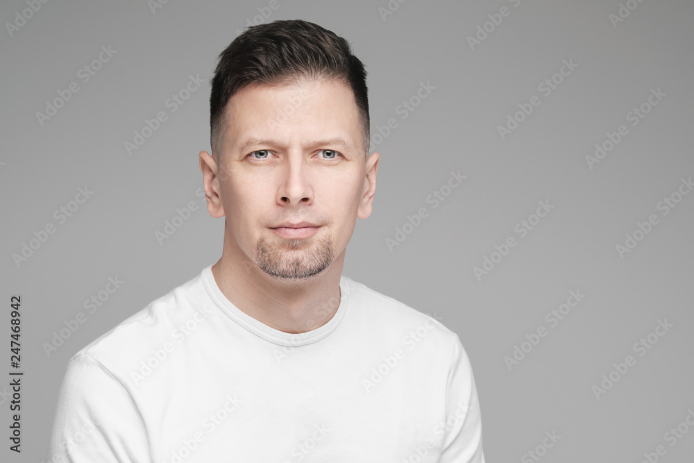 Futuristic handsome bearded brunet man 40s years in white clothes on a white background close-up. God, teacher and boss. Futuristic handsome bearded brunet man 40s years in white clothes on a white background close-up. God, teacher and boss.