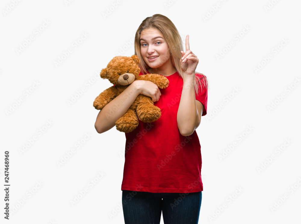 Young caucasian woman over isolated background with hand on chin thinking about question, pensive expression. Smiling with thoughtful face. Young caucasian woman over isolated background with hand on chin thinking about question, pensive expression. Smiling with thoughtful face.