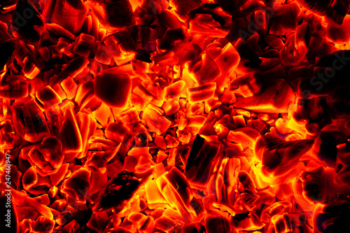 Glowing Hot Charcoal Briquettes Close-up Background Texture