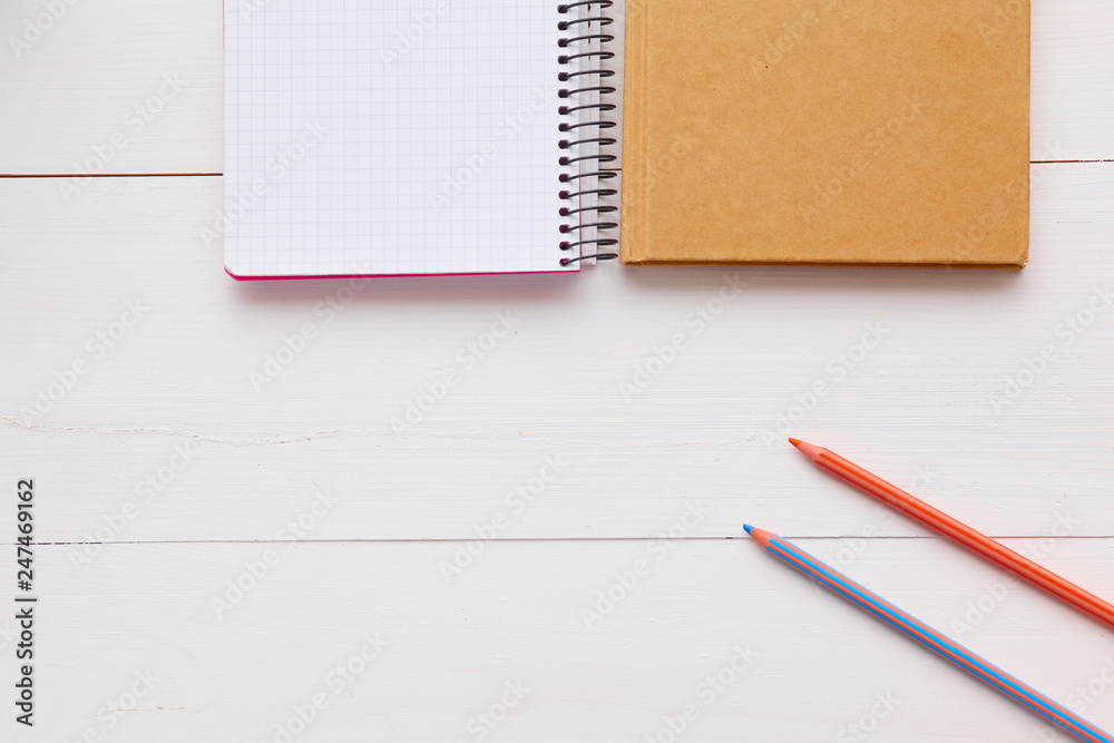 top view image of open notebook with blank pages on wooden table. ready for adding text or mockup. top view image of open notebook with blank pages on wooden table. ready for adding text or mockup.