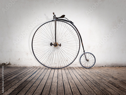 penny-farthing, high  wheel retro bike  on wood floor