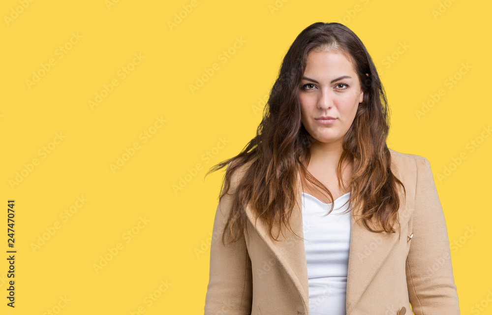 Beautiful plus size young woman wearing winter coat over isolated background skeptic and nervous, frowning upset because of problem. Negative person.