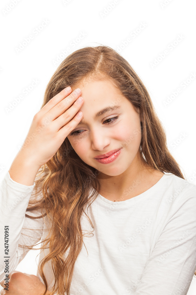 Young girl suffering from headache desperate and stressed because of pain and migraine with hands on head isolated on white background Young girl suffering from headache desperate and stressed because of pain and migraine with hands on head isolated on white background