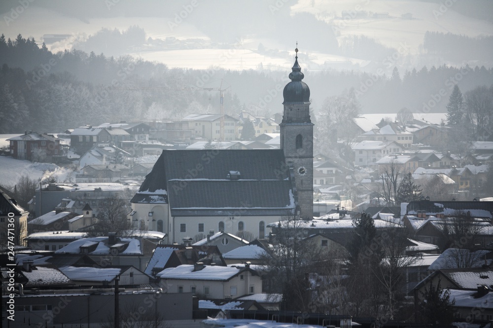 Winter village in austria focus on church