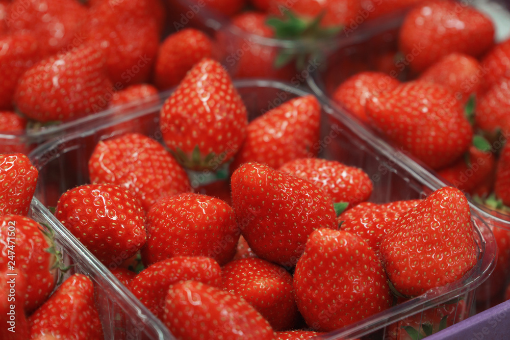 Baskets of fresh delicious Strawberries in store, closeup. Baskets of fresh delicious Strawberries in store, closeup.