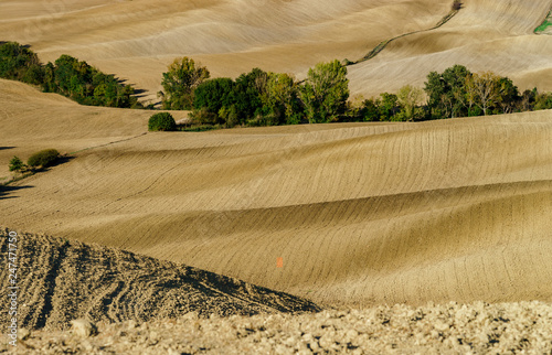 Abstract view of yellow and brown hills of Tuscane, autumn photo