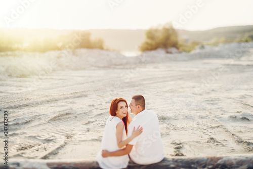 Happy young romantic couple in love have fun on beautiful beach.