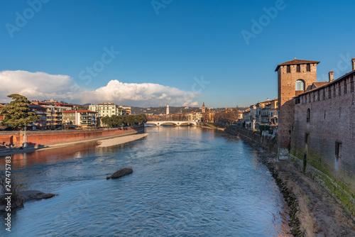 Evening view of the Adige river from the Castelvecchio bridge in Verona © Brambilla Simone