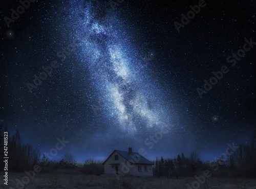 House under night sky with stars