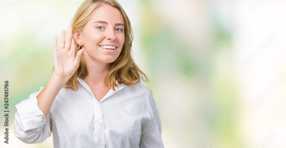 Beautiful young business woman over isolated background smiling with hand over ear listening an hearing to rumor or gossip. Deafness concept. Beautiful young business woman over isolated background smiling with hand over ear listening an hearing to rumor or gossip. Deafness concept.