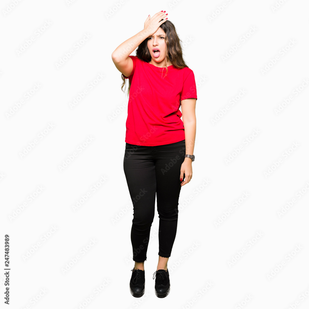 Young beautiful woman wearing casual t-shirt surprised with hand on head for mistake, remember error. Forgot, bad memory concept.