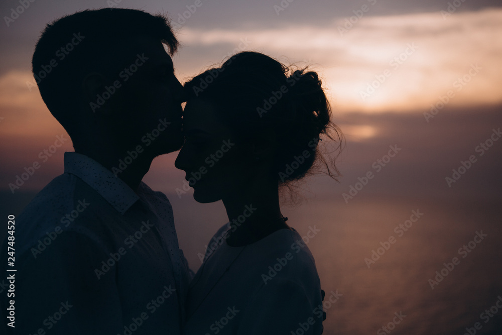 Beautiful couple on sunset photoshoot