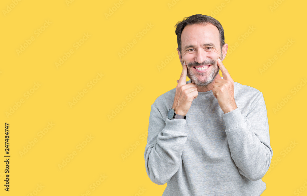 Handsome middle age senior man wearing a sweatshirt over isolated background Smiling with open mouth, fingers pointing and forcing cheerful smile Handsome middle age senior man wearing a sweatshirt over isolated background Smiling with open mouth, fingers pointing and forcing cheerful smile