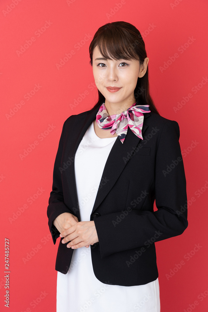 portrait of asian businesswoman isolated on red background portrait of asian businesswoman isolated on red background