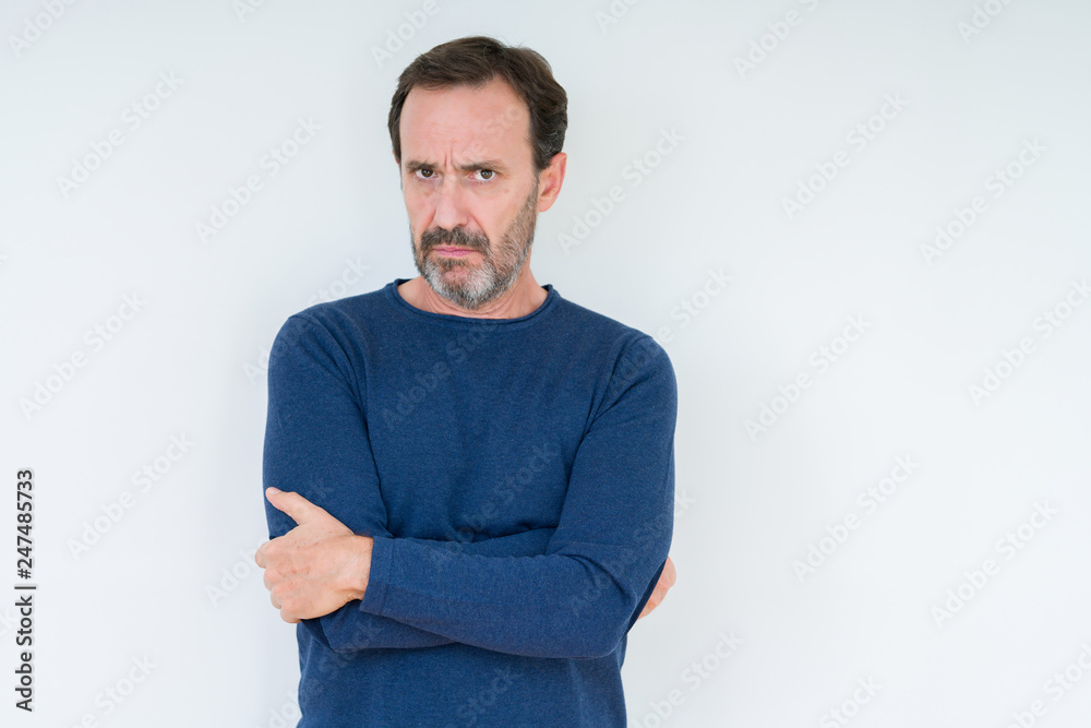 Elegant senior man over isolated background skeptic and nervous, disapproving expression on face with crossed arms. Negative person. Elegant senior man over isolated background skeptic and nervous, disapproving expression on face with crossed arms. Negative person.