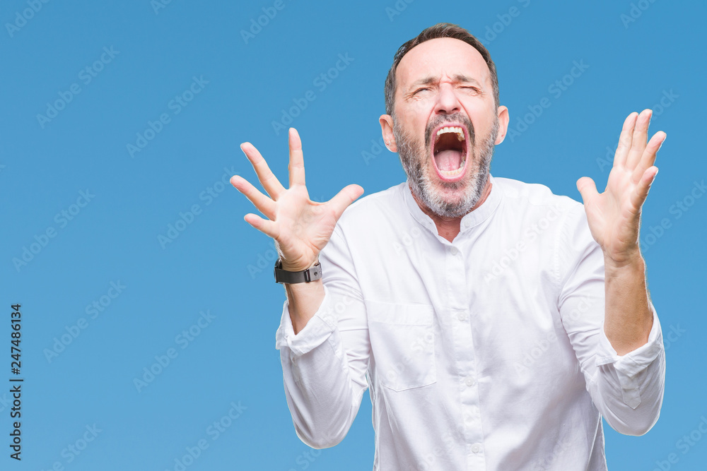 Middle age hoary senior man over isolated background crazy and mad shouting and yelling with aggressive expression and arms raised. Frustration concept. Middle age hoary senior man over isolated background crazy and mad shouting and yelling with aggressive expression and arms raised. Frustration concept.