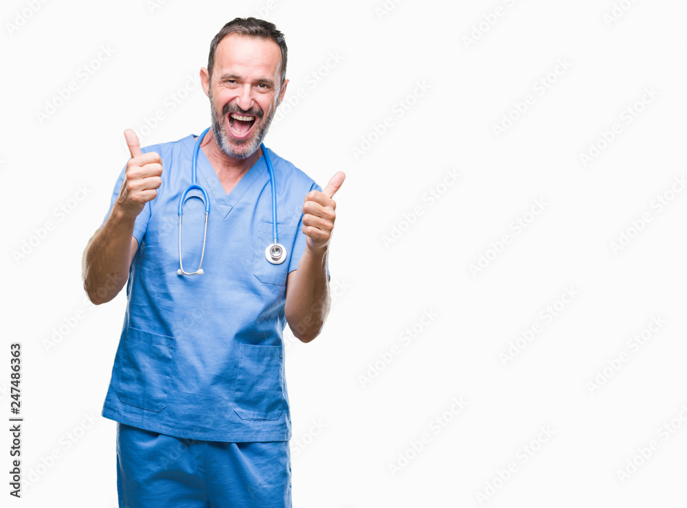 Middle age hoary senior doctor man wearing medical uniform over isolated background success sign doing positive gesture with hand, thumbs up smiling and happy. Looking at the camera Middle age hoary senior doctor man wearing medical uniform over isolated background success sign doing positive gesture with hand, thumbs up smiling and happy. Looking at the camera