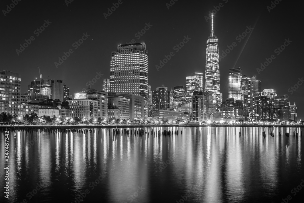 One World Trade Center and Battery Park City at night, seen from Pier 34, Manhattan, New York.