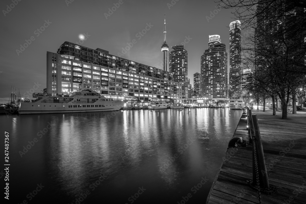 Buildings along Lake Ontario at night, at the Harbourfront in Toronto, Ontario.