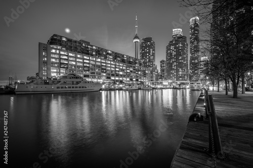 Buildings along Lake Ontario at night  at the Harbourfront in Toronto  Ontario.