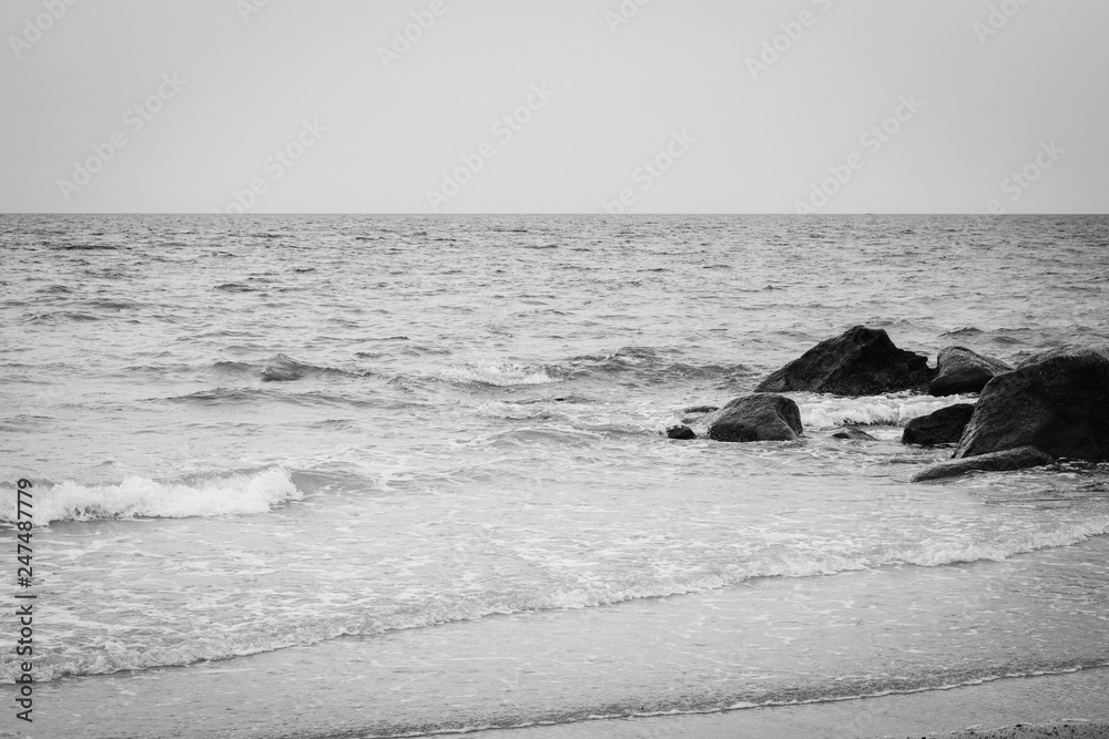 Rocks in the Atlantic Ocean at Town Beach, in Sandwich, Cape Cod, Massachusetts.