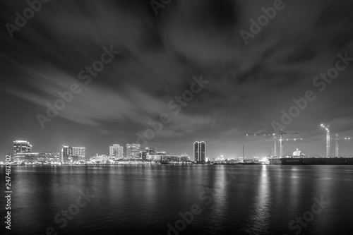 The skyline of Norfolk at night, seen from the waterfront in Portsmouth, Virginia.