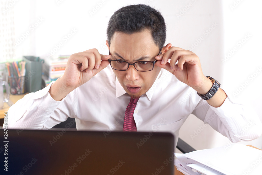 Shocked Businessman Looking at His Laptop, Failure Bad News Concept Shocked Businessman Looking at His Laptop, Failure Bad News Concept
