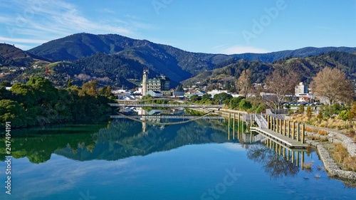 Panorama of Nelson City, reflected in the Maitai River, New Zealand. photo