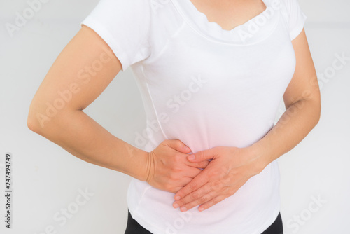 Woman having painful stomachache photo