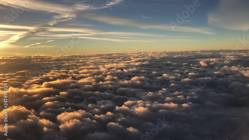 sun rising over clouds