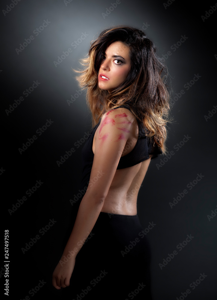 young beautiful Hispanic woman is wearing a tight sexy black dress and has nice long black hair young beautiful Hispanic woman is wearing a tight sexy black dress and has nice long black hair