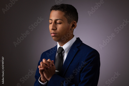 Slika na platnu Hispanic Teenager Boy Seeking to Commune with God Via Prayer