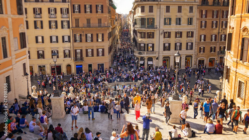Tourists sit on the Spanish Steps at Piazza di Spagna in Rome, Italy