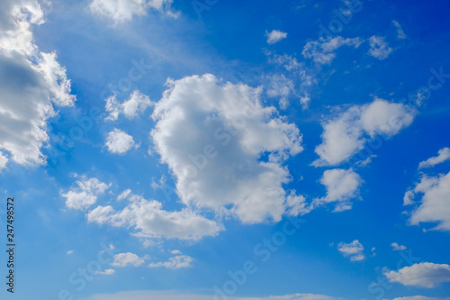 Fluffy cloud above beautiful blue sky background