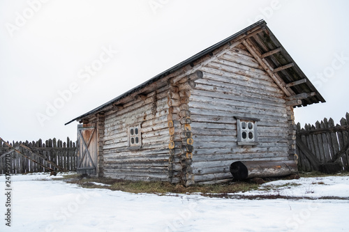 wooden house, frame, old, decrepit, in the field in winter © mira_y