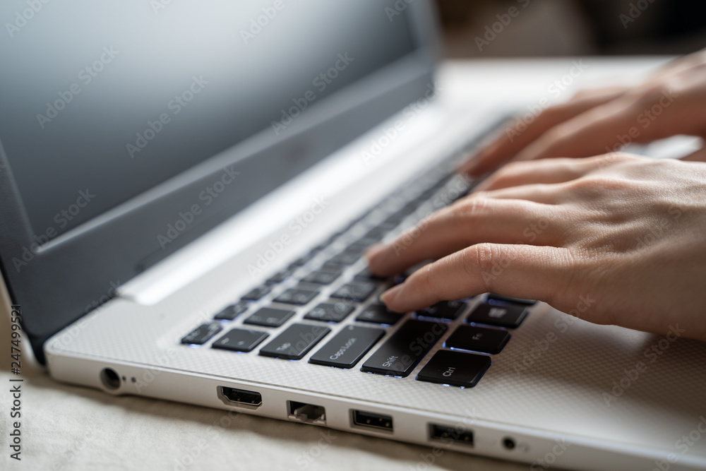 Business woman typing on keyboard. Shallow dof.