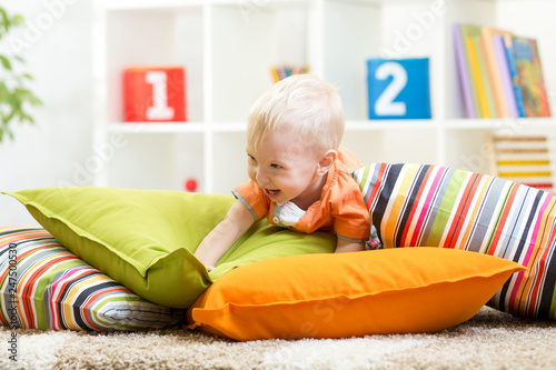 Adorable little kid boy pla...