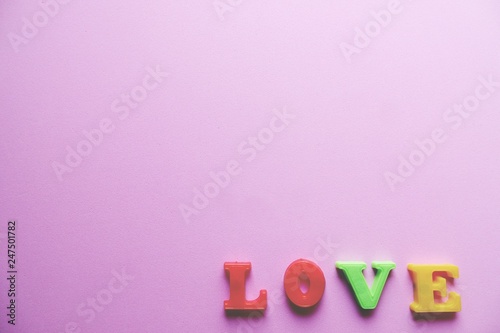 'love' word Close-up shot with a selective focus of the colorful magnetic letters for Valentine's Day
