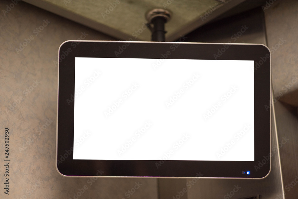 TV screen in elevator.