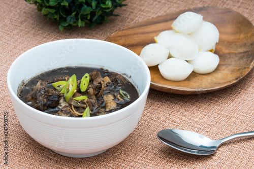 stewed pork blood with pork meat and delicious puto or also known as dinuguan photo